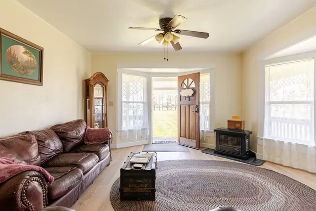 a kitchen with granite countertop a sink stainless steel appliances and cabinets