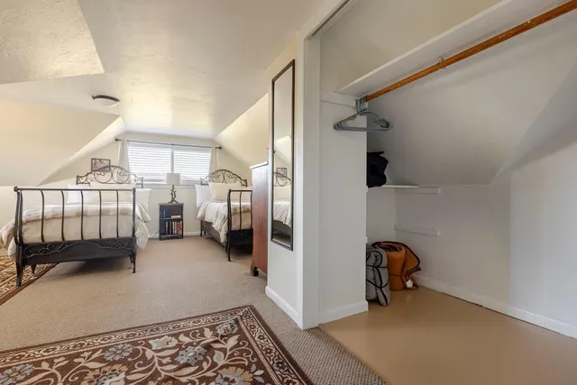 a bathroom with a granite countertop sink a mirror a shower and a bathtub