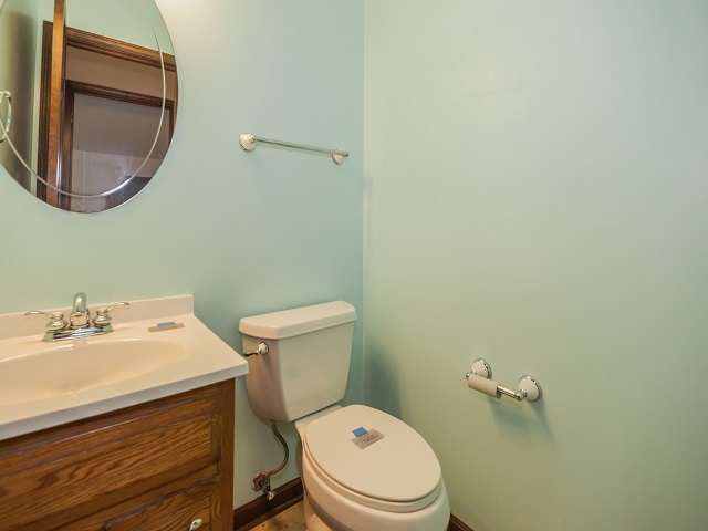 11N728 Old Barn Road Elgin, IL 60124 - Photo 22 of 25 a bathroom with a toilet a sink and mirror