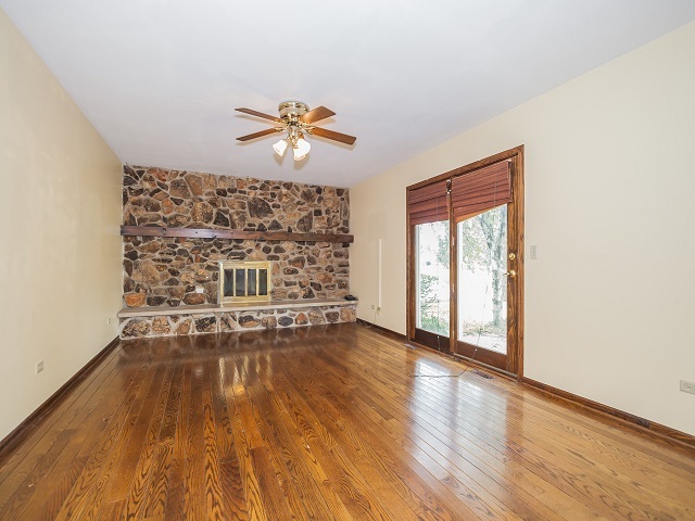 11N728 Old Barn Road Elgin, IL 60124 - Photo 6 of 25 a view of workspace with wooden floor and ceiling fan