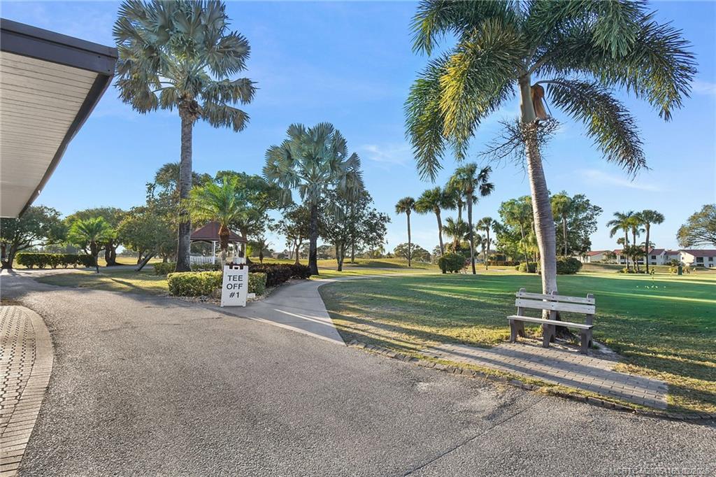5413 Southeast Miles Grant Road, Unit G206 Stuart, FL 34997 - Photo 36 of 79 a view of a park with palm trees