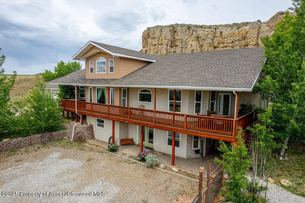 289 Lewis Lane Craig, CO 81625 - Photo 3 of 104 a aerial view of a house with a yard and plants