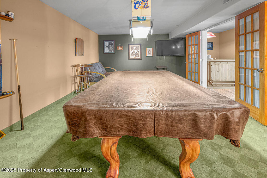 289 Lewis Lane Craig, CO 81625 - Photo 58 of 104 a bed sitting in a bedroom next to a window