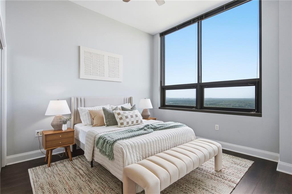 270 17th Street Northwest, Unit 4306 Atlanta, GA 30363 - Photo 16 of 37 a bedroom with bed and a window