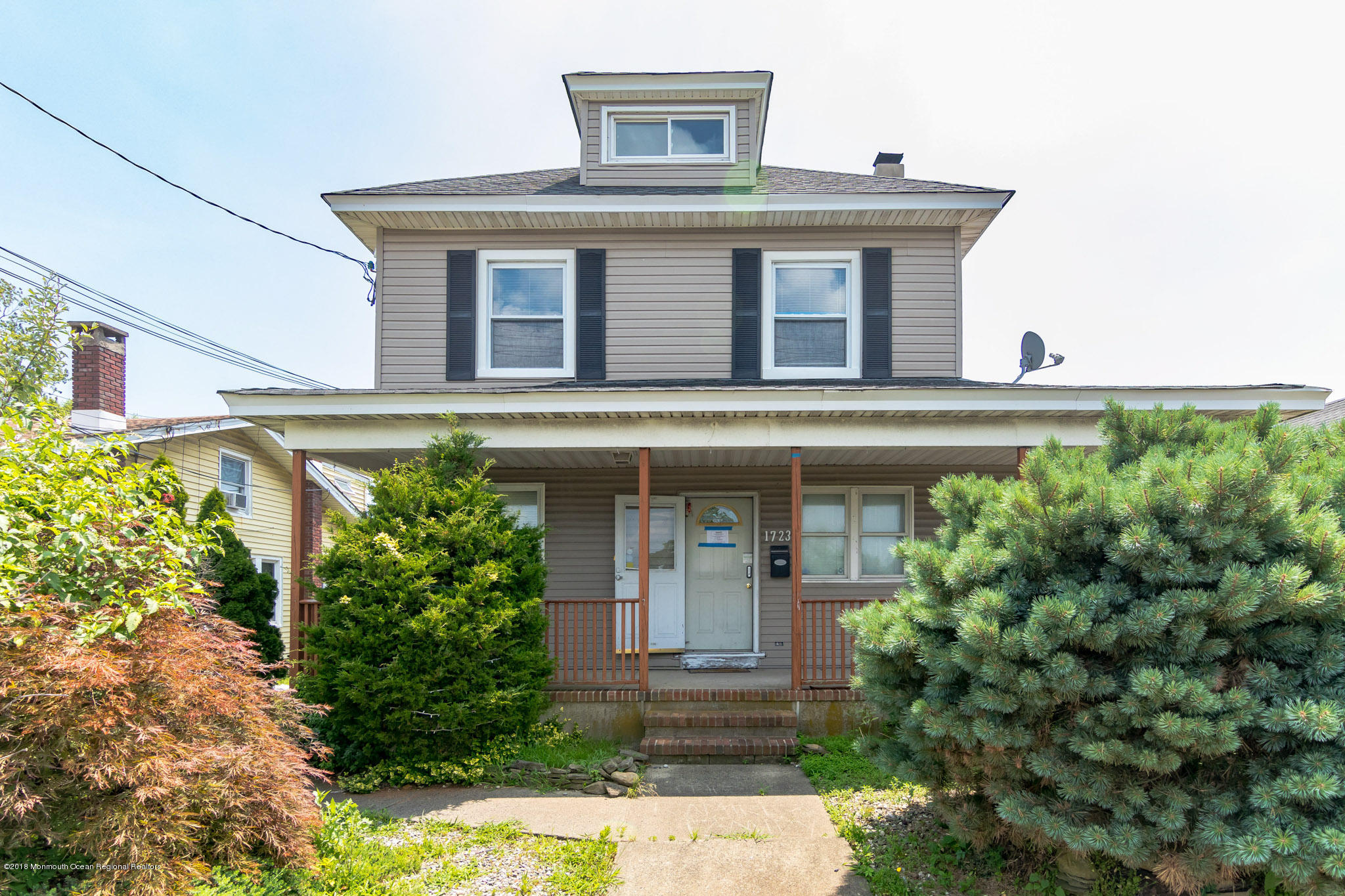 1723 River Road Belmar, NJ 07719 - Photo 1 of 29 a front view of a house with plants