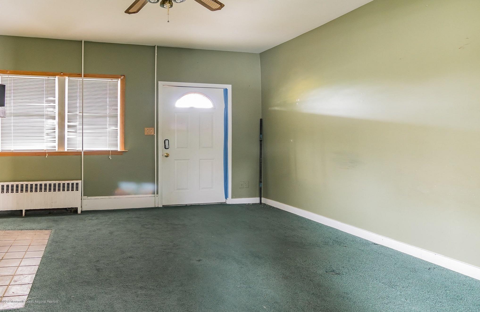 1723 River Road Belmar, NJ 07719 - Photo 17 of 29 an empty room with a window