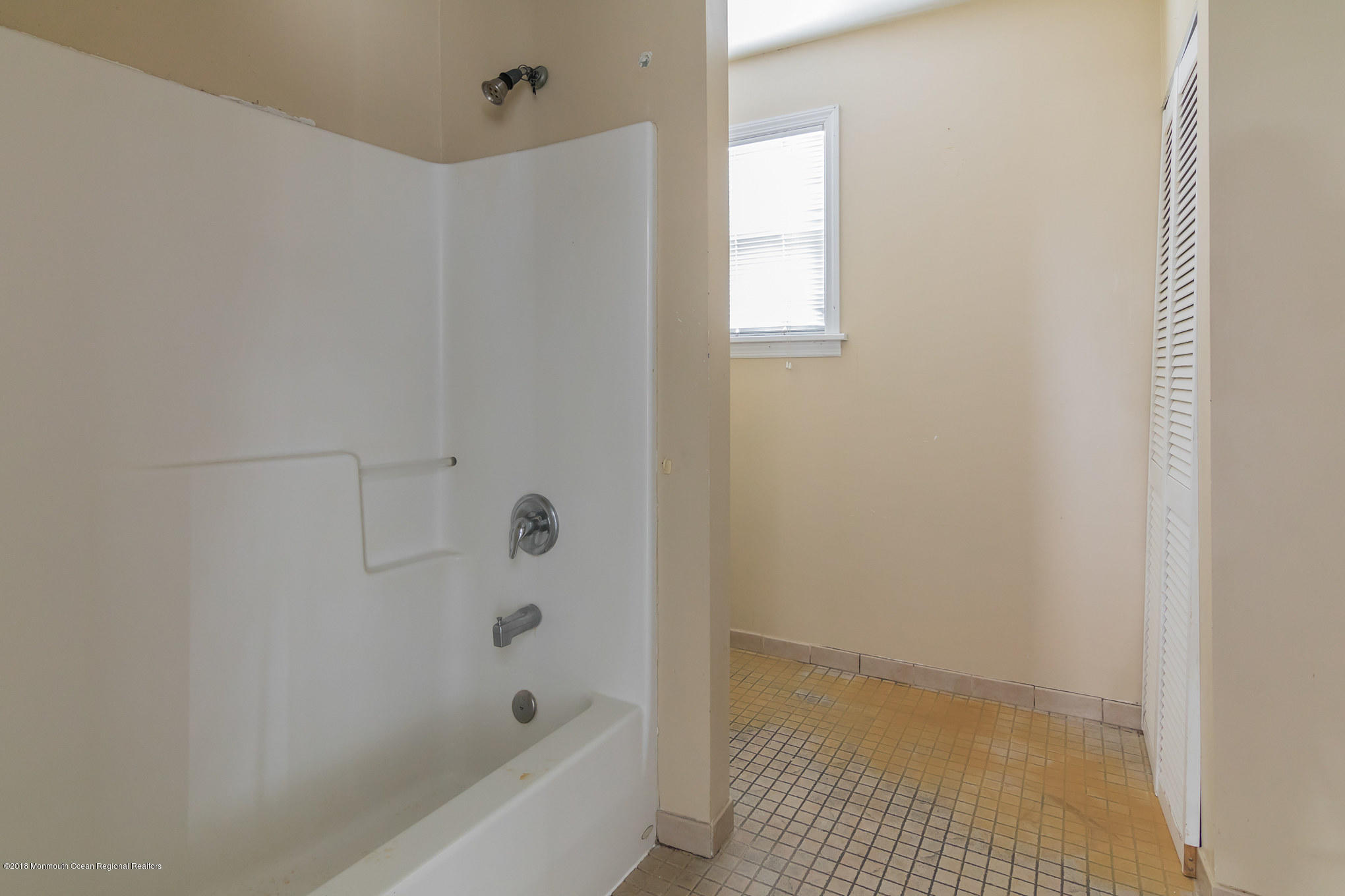 1723 River Road Belmar, NJ 07719 - Photo 28 of 29 a bathroom with a bathtub