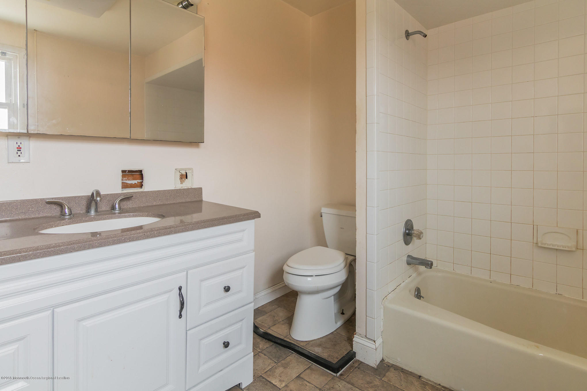 1723 River Road Belmar, NJ 07719 - Photo 29 of 29 a bathroom with a sink a toilet and bathtub
