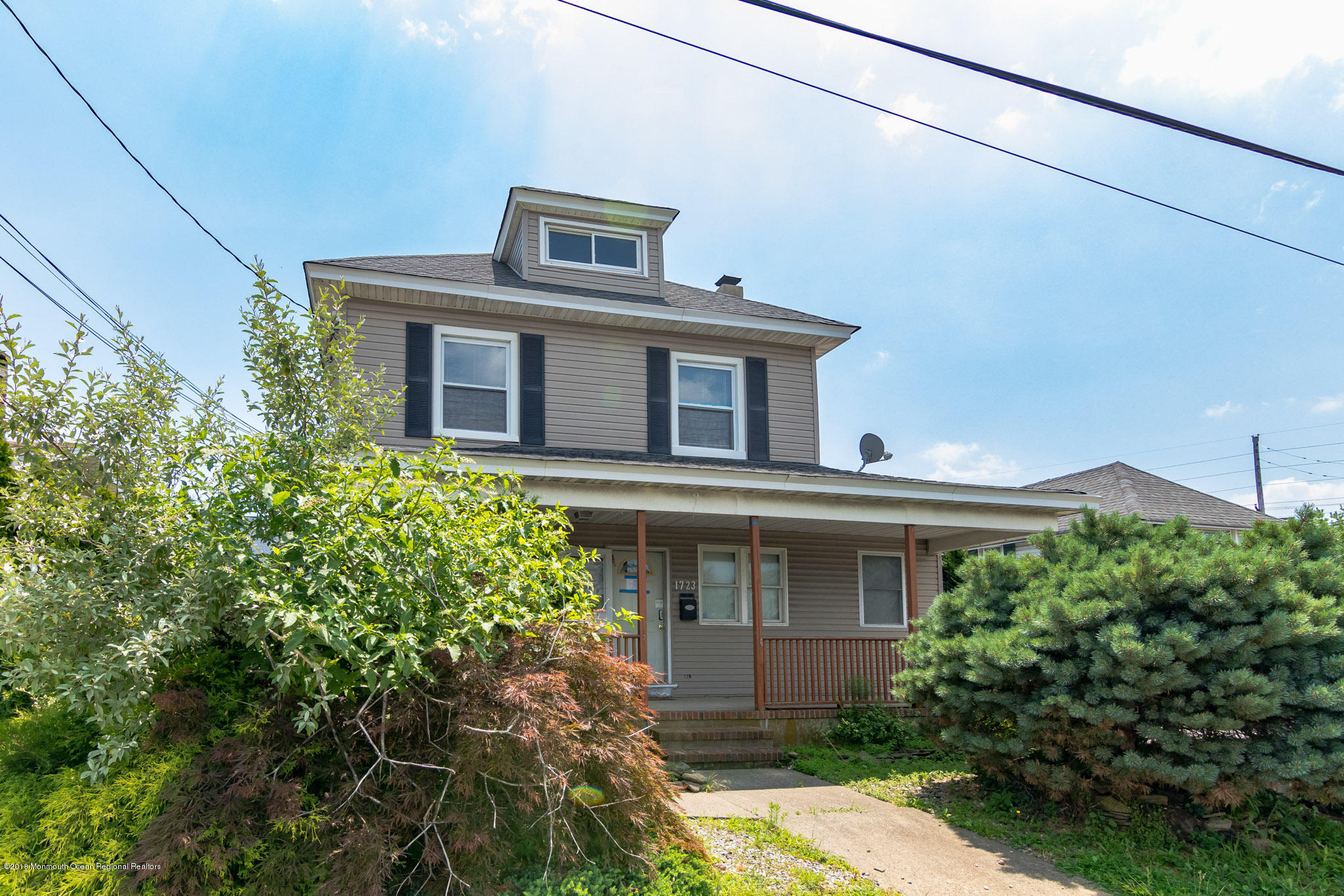 1723 River Road Belmar, NJ 07719 - Photo 6 of 29 a front view of a house with garden