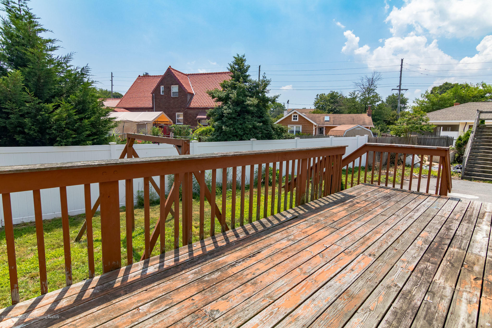 1723 River Road Belmar, NJ 07719 - Photo 7 of 29 a view of balcony with wooden floor & fence
