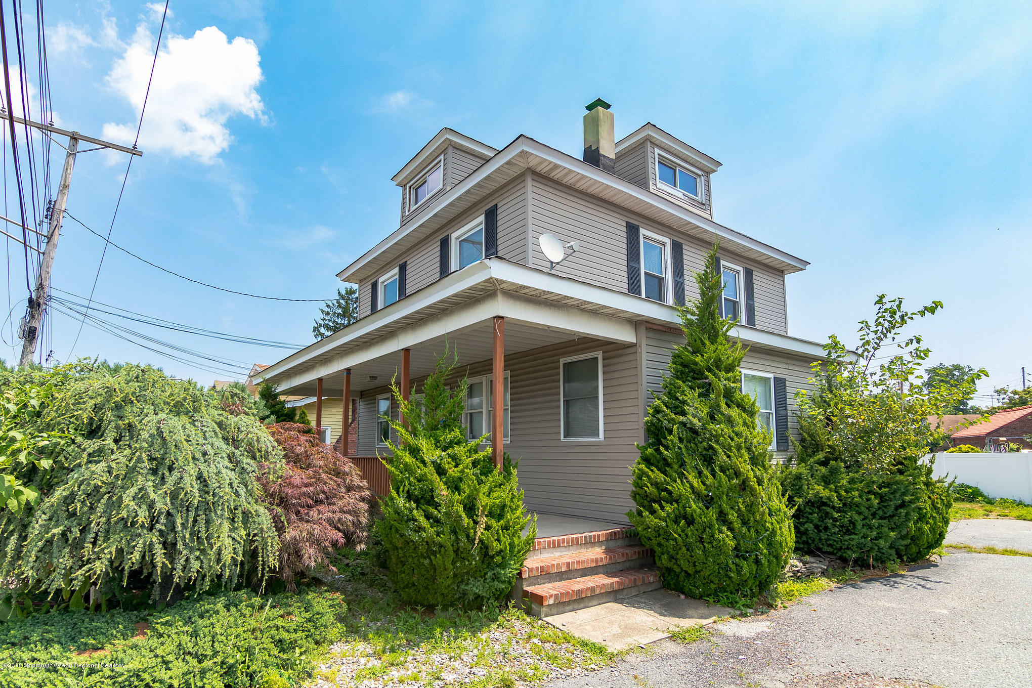 1723 River Road Belmar, NJ 07719 - Photo 8 of 29 a front view of a house with plants