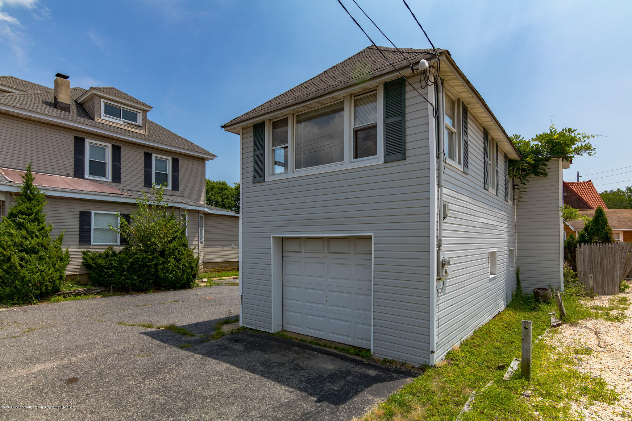1723 River Road Belmar, NJ 07719 - Photo 9 of 29 a front view of a house with a yard