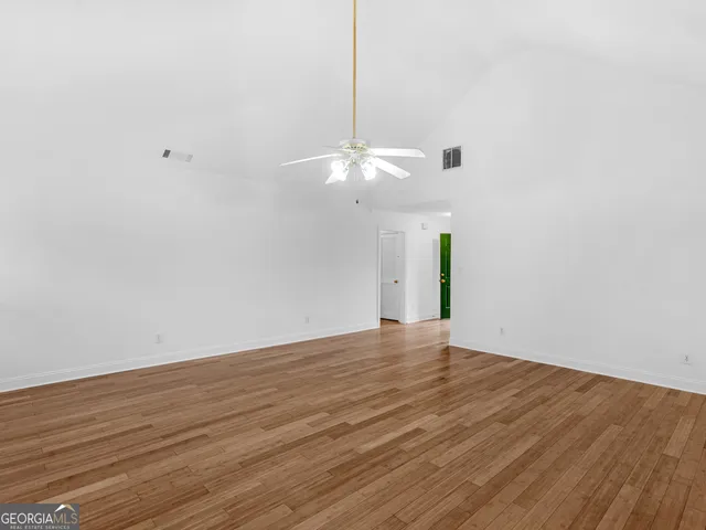 a kitchen with stainless steel appliances granite countertop a stove cabinets and refrigerator