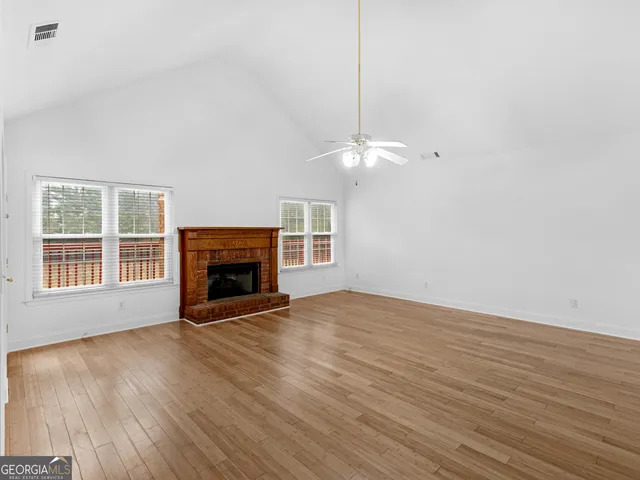 a kitchen with stainless steel appliances granite countertop a refrigerator oven a sink dishwasher and microwave