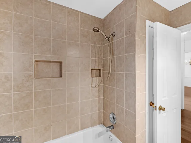 a kitchen with granite countertop white cabinets and sink