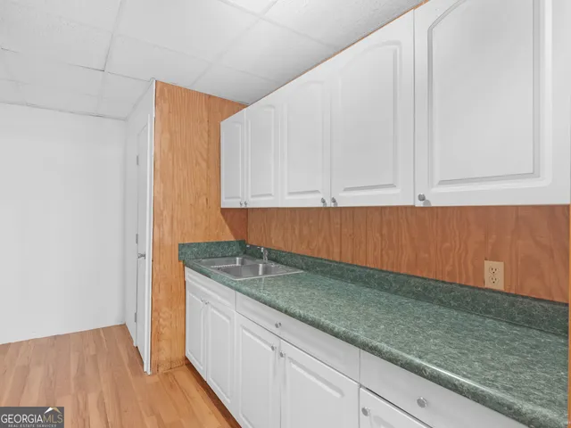 a view of an empty room with a fireplace