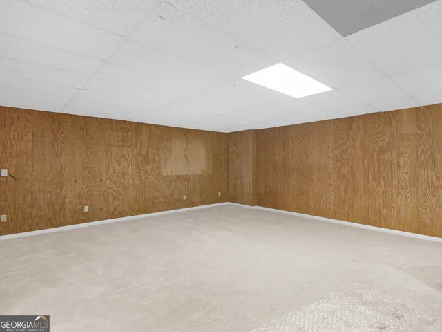 a balcony with wooden floor and fence