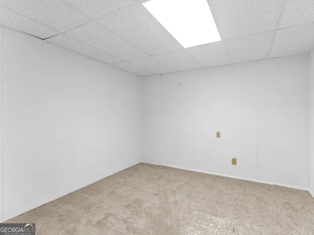 a picture of a wall with a white wall and white cabinet