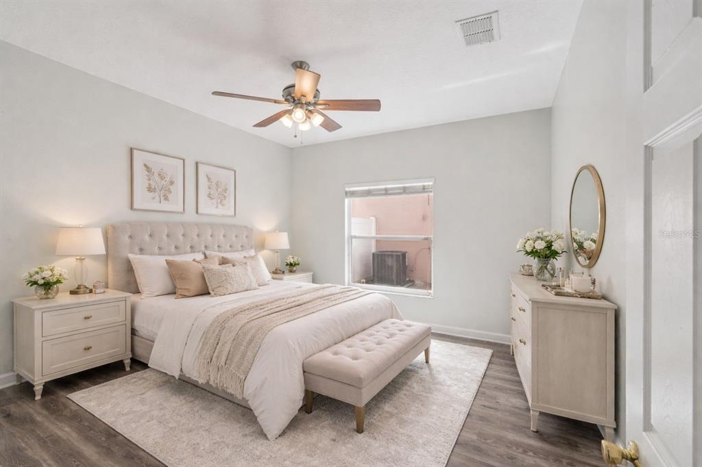 16178 Old Ash Loop Orlando, FL 32828 - Photo 13 of 24 a bedroom with a large bed and a window