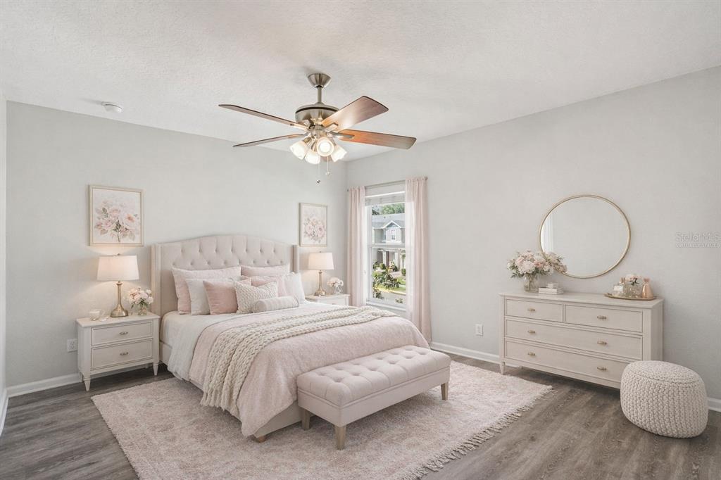 16178 Old Ash Loop Orlando, FL 32828 - Photo 16 of 24 a bedroom with a bed and wooden floor