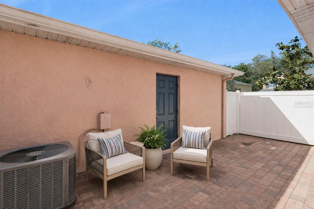 16178 Old Ash Loop Orlando, FL 32828 - Photo 18 of 24 a view of patio with a table and chairs