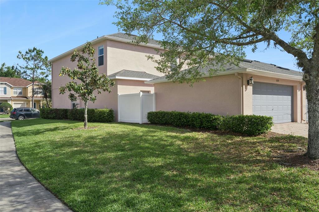 16178 Old Ash Loop Orlando, FL 32828 - Photo 20 of 24 a view of a house with a yard