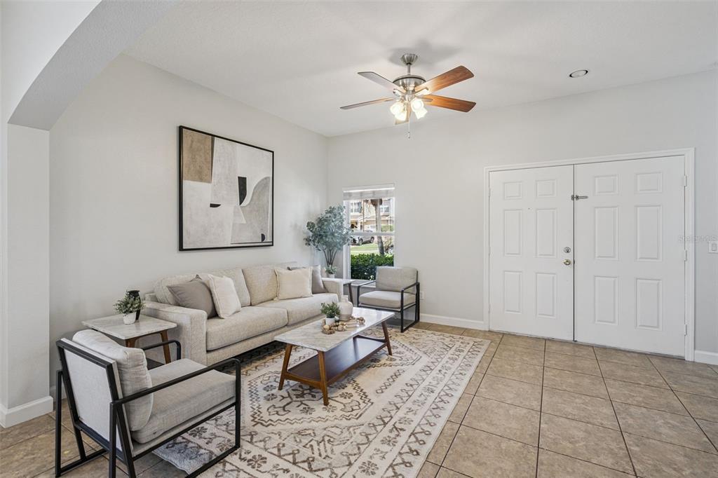 16178 Old Ash Loop Orlando, FL 32828 - Photo 2 of 24 a living room with furniture and a view of kitchen