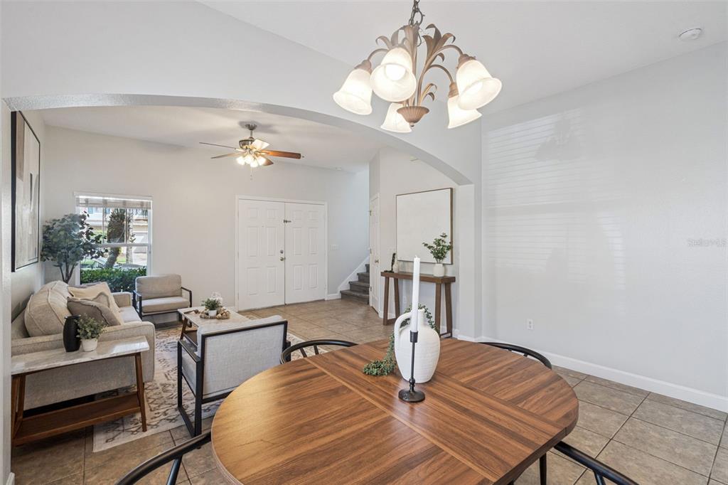 16178 Old Ash Loop Orlando, FL 32828 - Photo 4 of 24 a view of a dining room with furniture