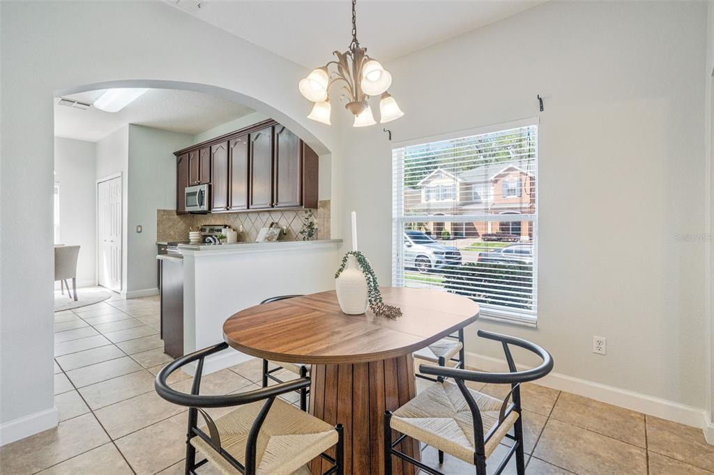 16178 Old Ash Loop Orlando, FL 32828 - Photo 5 of 24 a view of a dining room with furniture and window