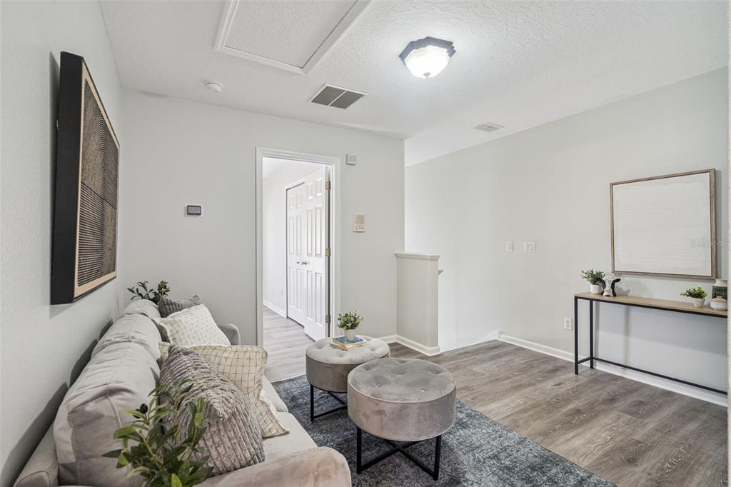 16178 Old Ash Loop Orlando, FL 32828 - Photo 8 of 24 a living room with furniture and wooden floor