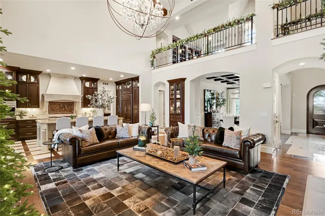 a view of a patio with couches table and chairs and potted plants