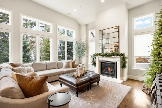 a spacious bedroom with a bed and a chandelier