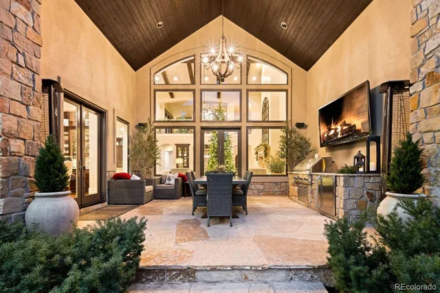 a view of a patio with couches and potted plants