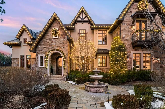 a living room with fireplace furniture and a rug