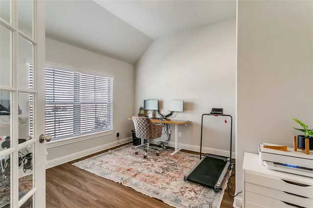 a workspace with furniture and a window