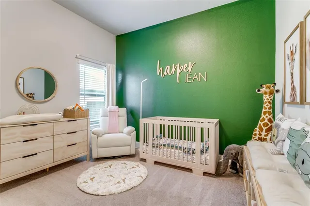 a bedroom with a bed and a chair