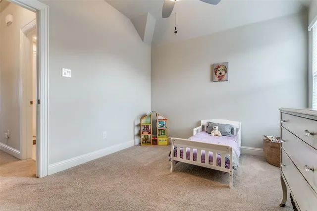 a bedroom with a bed and a table