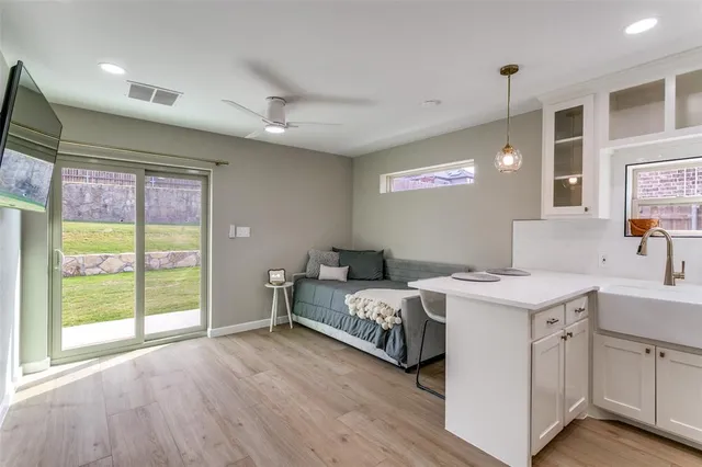 a bedroom with a bed and a large window
