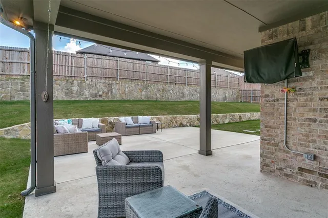 a patio with table and chairs