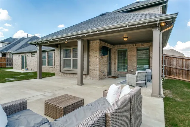 a view of house with outdoor seating space