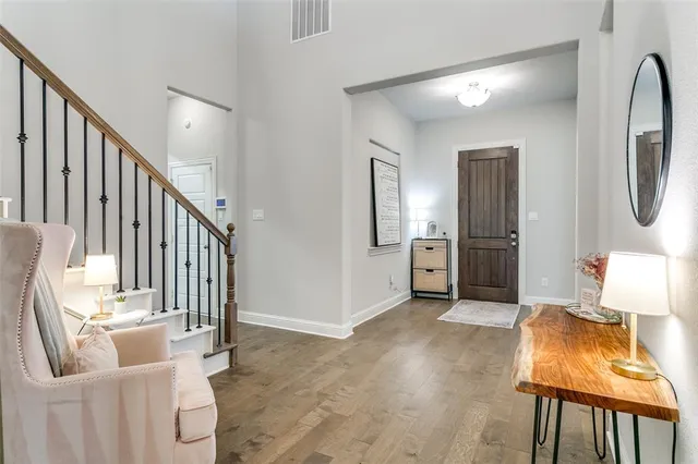 a view of an entryway with wooden floor
