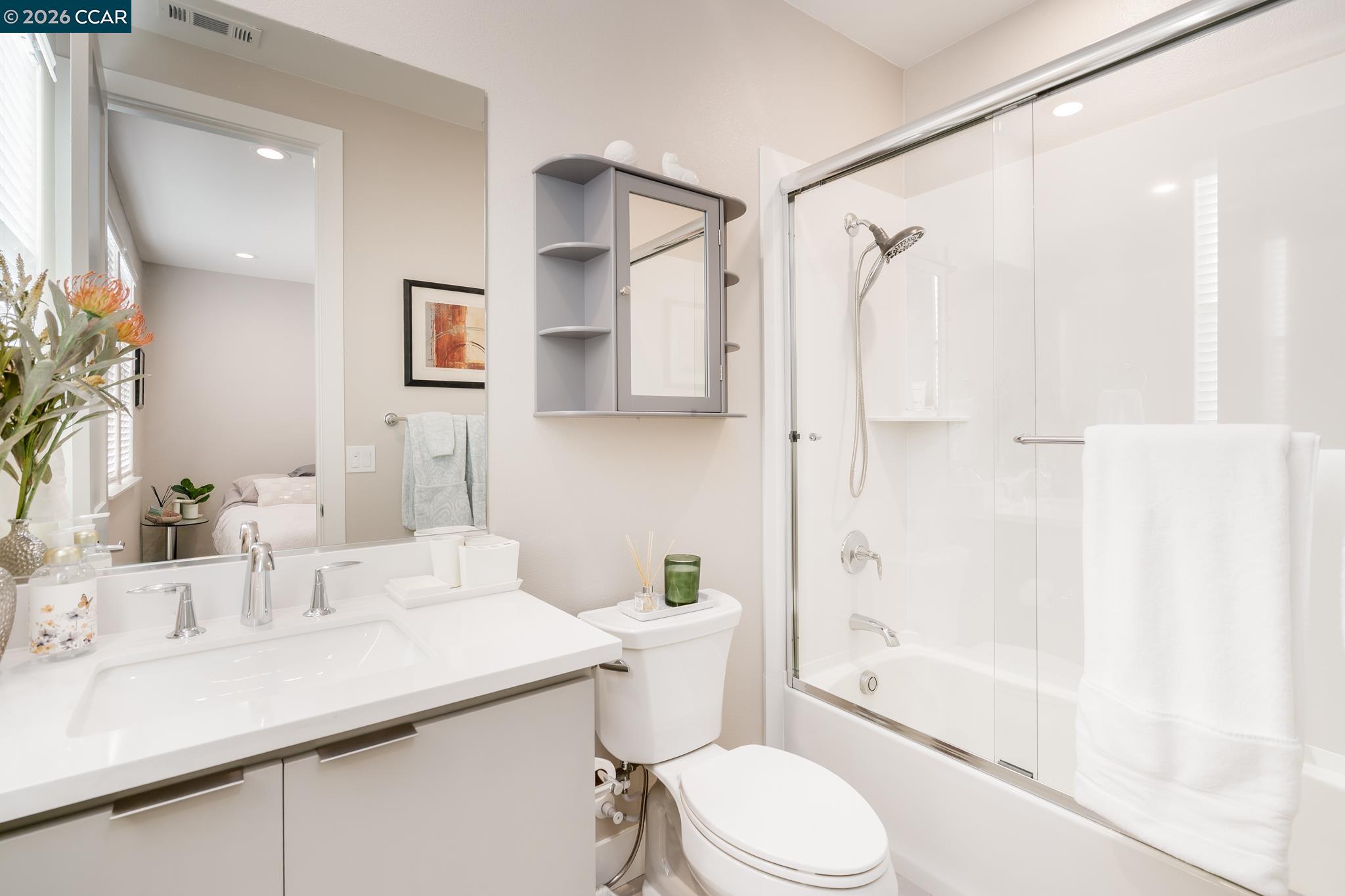 1200 Lorenzini Loop San Ramon, CA 94583 - Photo 15 of 35 a bathroom with a sink toilet and shower