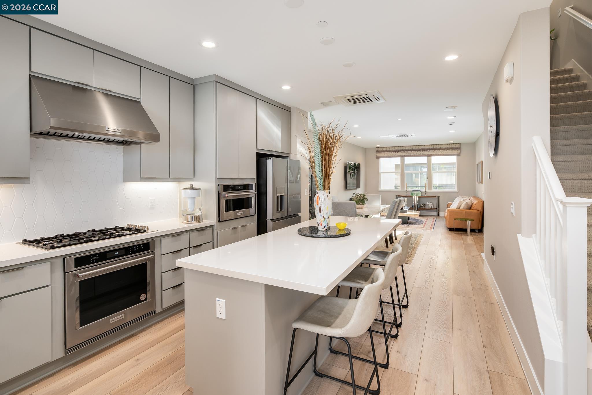 1200 Lorenzini Loop San Ramon, CA 94583 - Photo 5 of 35 a kitchen with a stove a refrigerator and a stove top oven