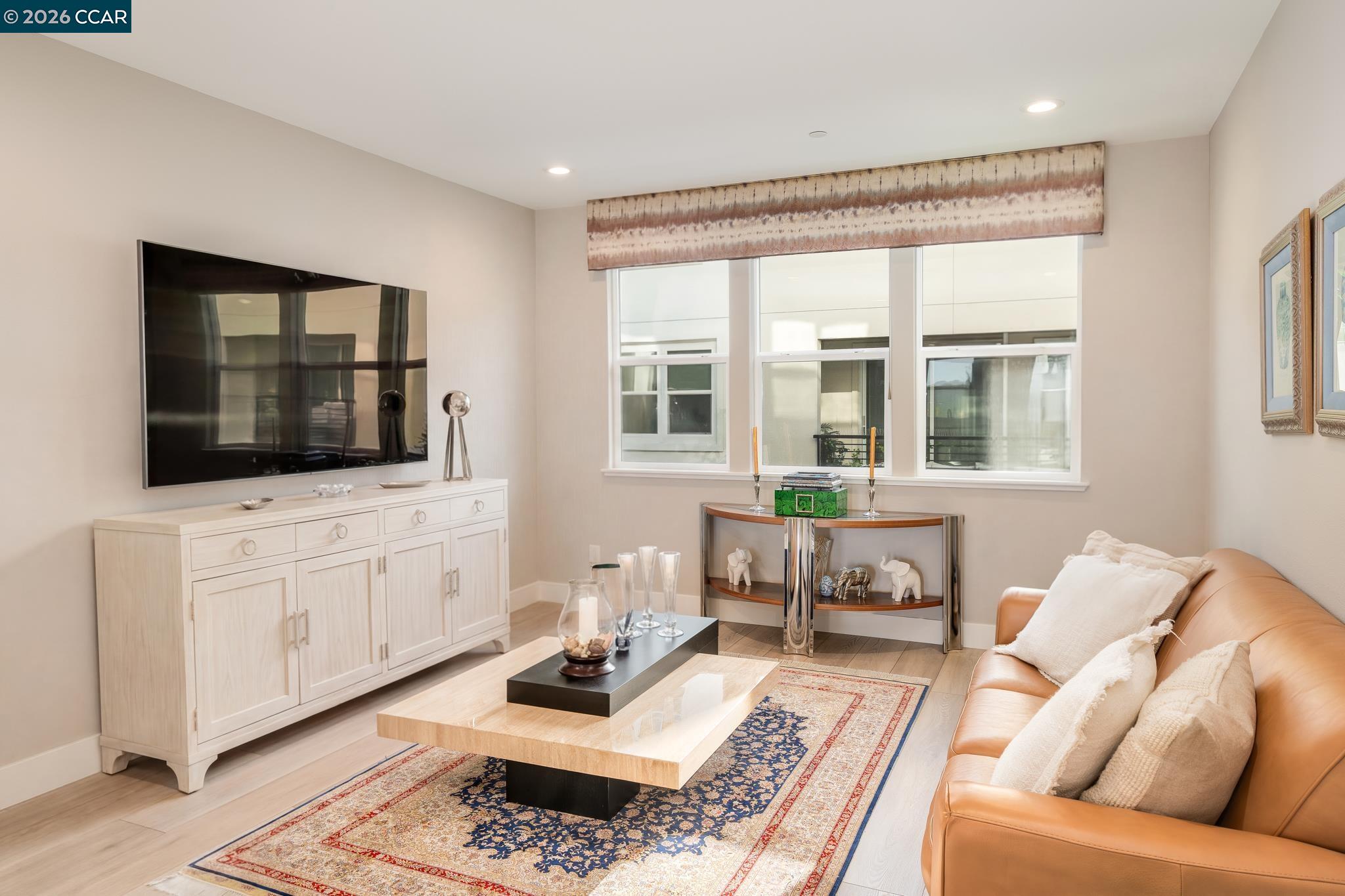 1200 Lorenzini Loop San Ramon, CA 94583 - Photo 7 of 35 a living room with furniture fireplace and flat screen tv