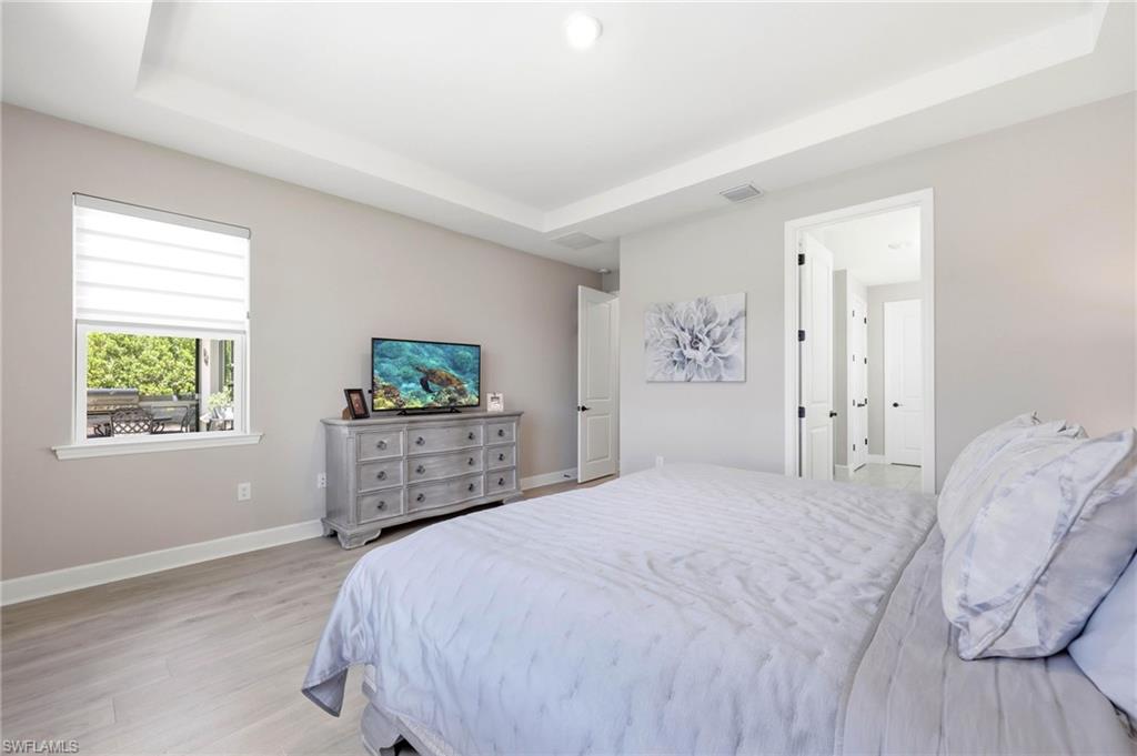 2094 Grove Drive Naples, FL 34120 - Photo 12 of 40 a bedroom with a bed and a window