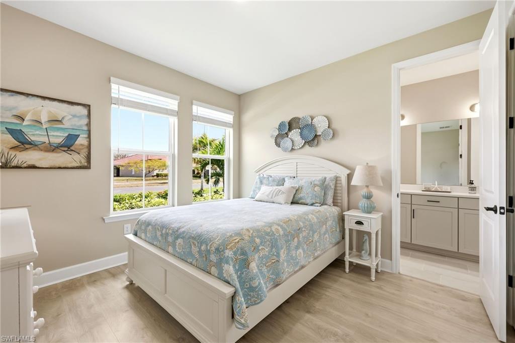 2094 Grove Drive Naples, FL 34120 - Photo 15 of 40 a bedroom with a bed and a window