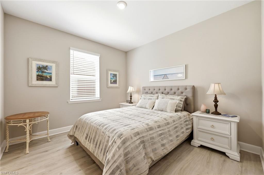 2094 Grove Drive Naples, FL 34120 - Photo 17 of 40 a bedroom with a bed and a window