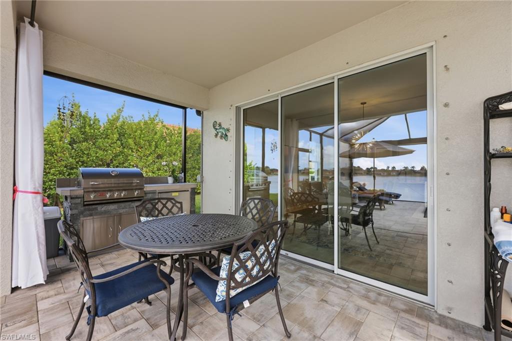 2094 Grove Drive Naples, FL 34120 - Photo 24 of 40 a view of a dining room with furniture window and outside view
