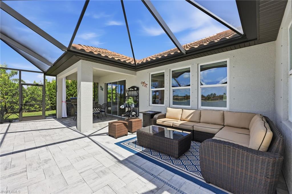 2094 Grove Drive Naples, FL 34120 - Photo 26 of 40 a view of a patio with couches and potted plant