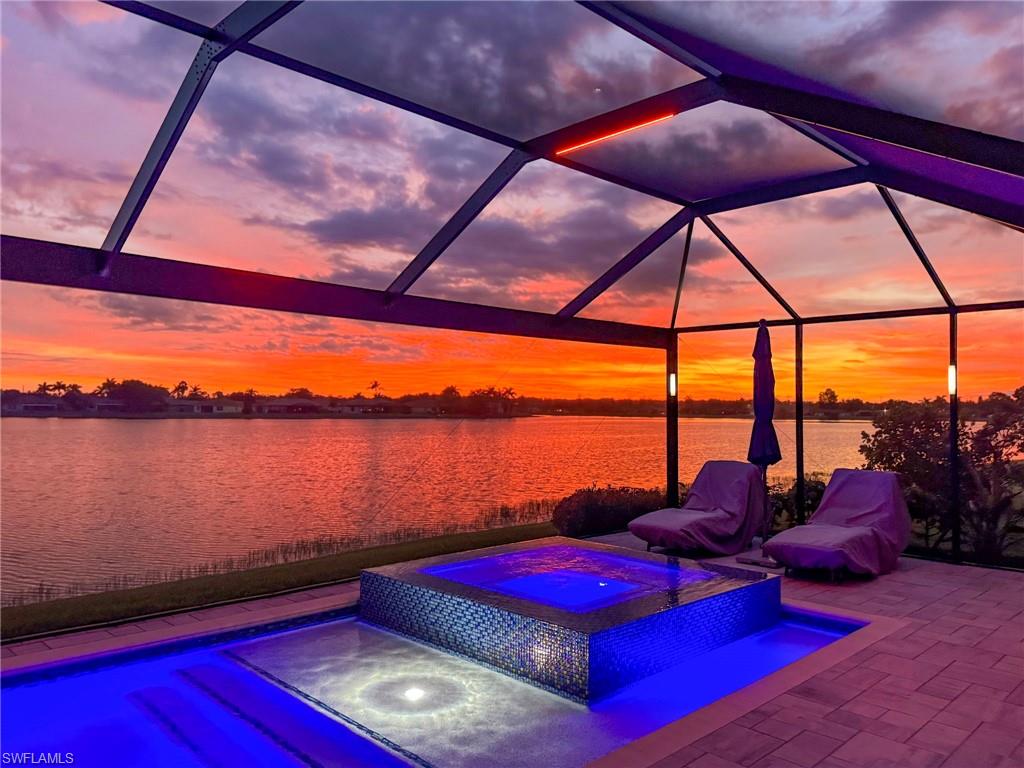 2094 Grove Drive Naples, FL 34120 - Photo 30 of 40 a outdoor space with furniture and umbrella